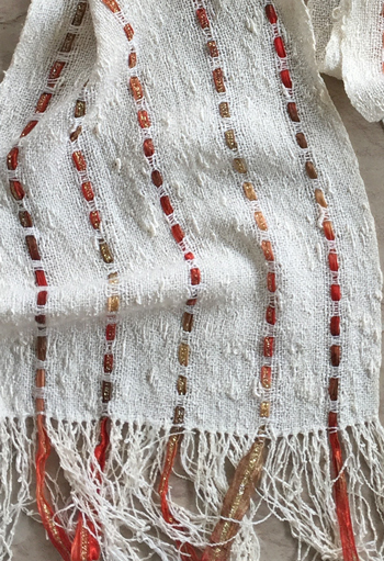 closeup of rayon seed scarf with gold