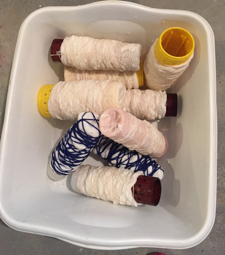 socks wrapped on plastic tubes for dyeing