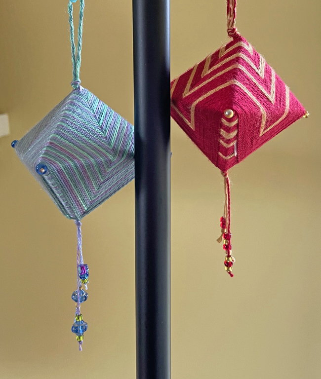 2 dragon boat wrapped ornaments