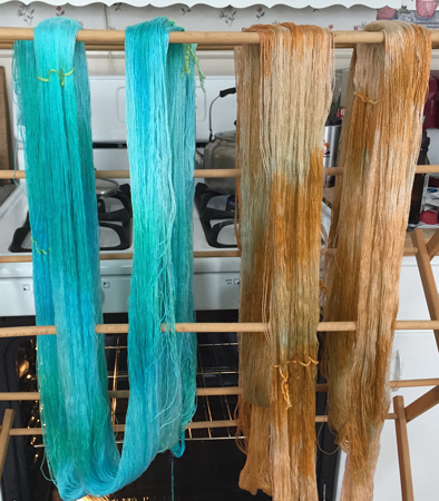 turquoise and terra cotta yarn drying