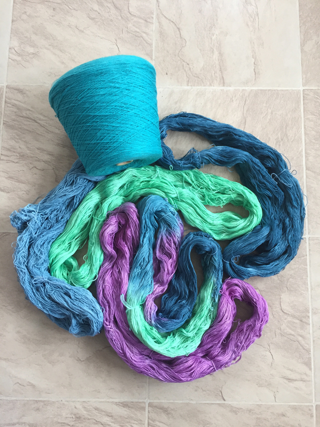 hand dyed skeins with a commercial cone